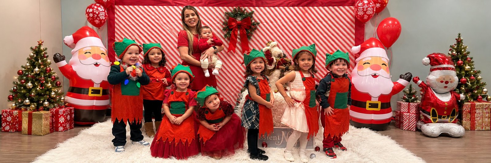 The group dressed as elves at the Christmas celebration